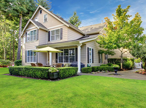 Two story, beige home with insurance in Perrysburg