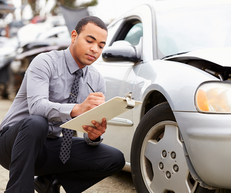 An Independent Insurance Agent accessing car damage near Wauseon, OH