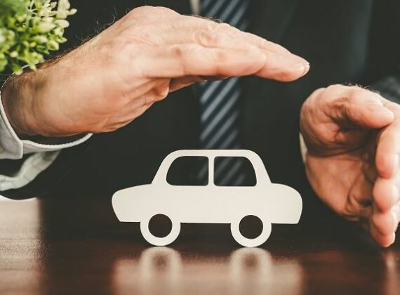 Hands Over Paper Car for Car Insurance in Waterville, OH