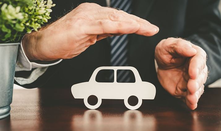 Hands Over Paper Car for Car Insurance in Perrysburg, Bryan, OH, Toledo, Wauseon, OH, Napoleon, OH, and Delta, OH