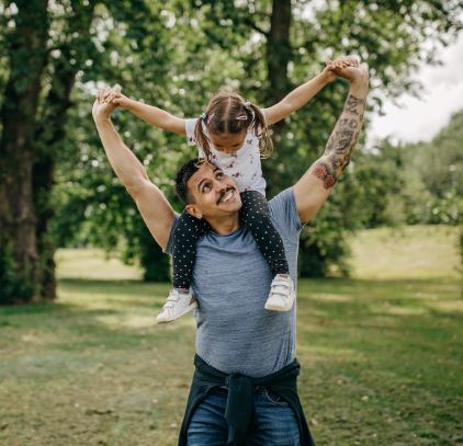 Dad Holding Daughter on His Shoulders after working with an Insurance Agency in Swanton, OH