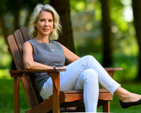 Woman Sitting on Rocking Chair After Receiving Insurance from an Insurance Agency in Delta, OH