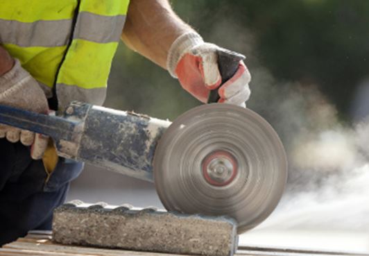 Contractors Cutting Brick with Contractors Insurance in Holland, Ohio 