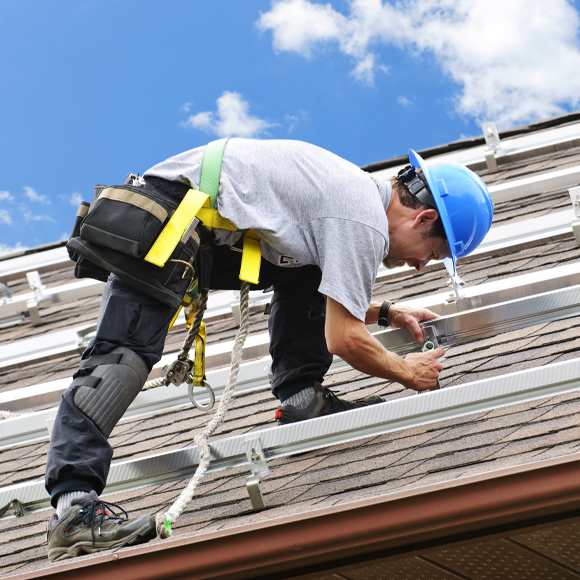 worker on roof with Small Business Insurance in Whitehouse, Ohio